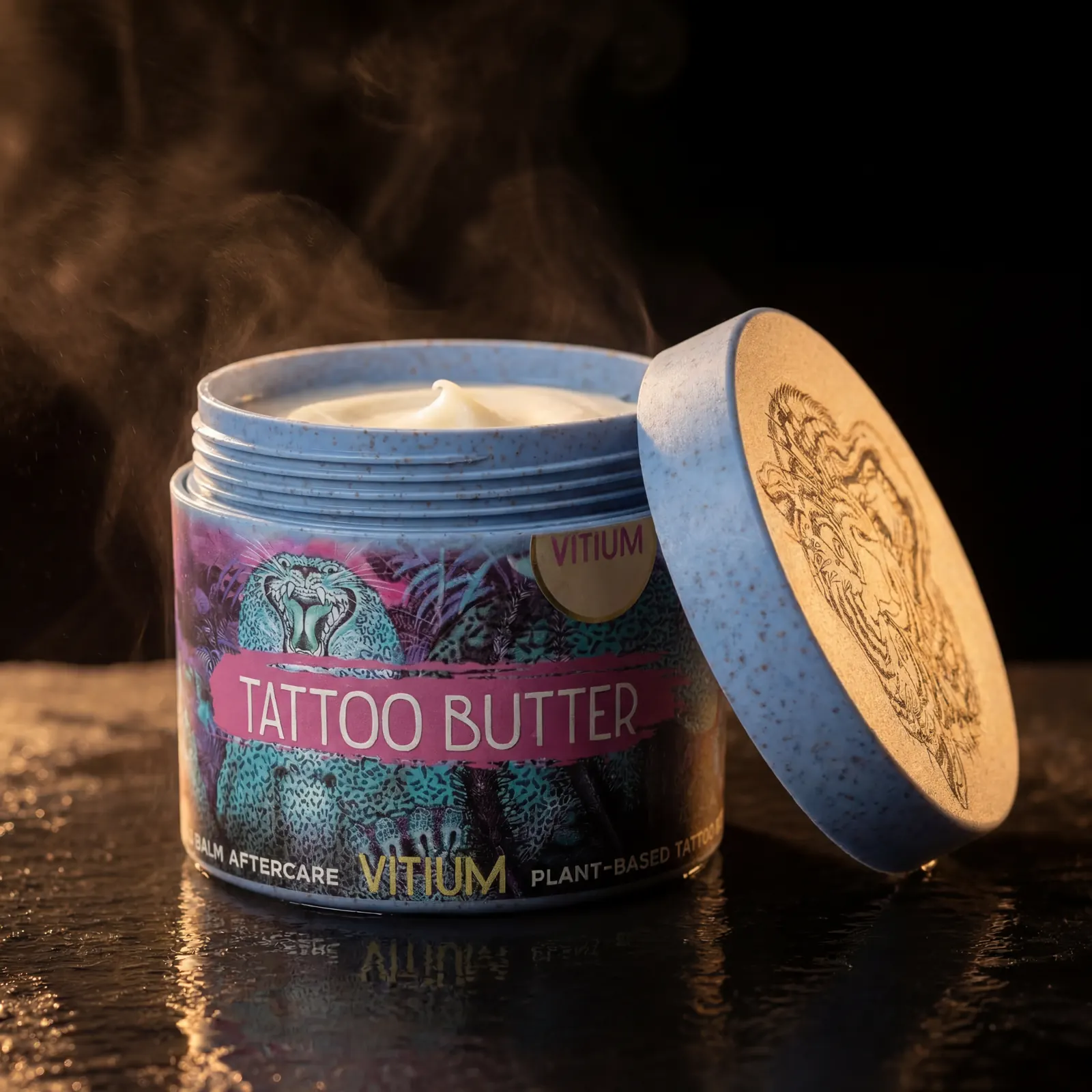VITIUM Tattoo Butter — open jar revealing the pale cream plant-based balm, lid placed beside, warm atmospheric lighting